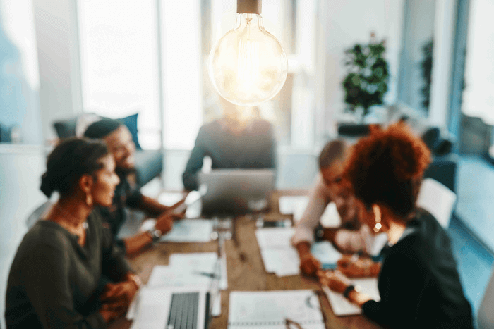 people working at a table together